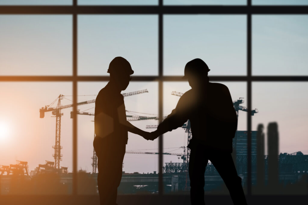 Project management Silhouette of engineer and construction team working at site over blurred background for industry background with Light fair